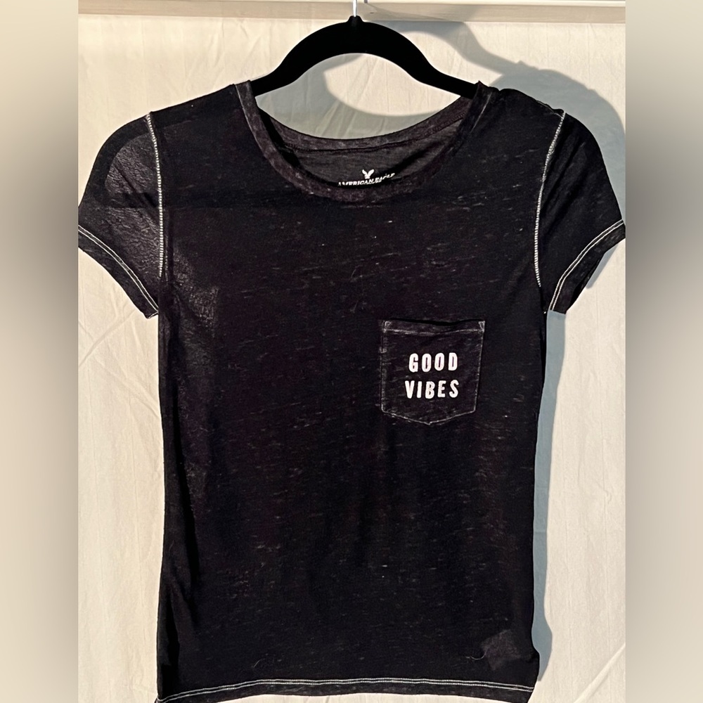 American eagle heathered black pocket tee.  Size XXS with “Good Vibes” on front
